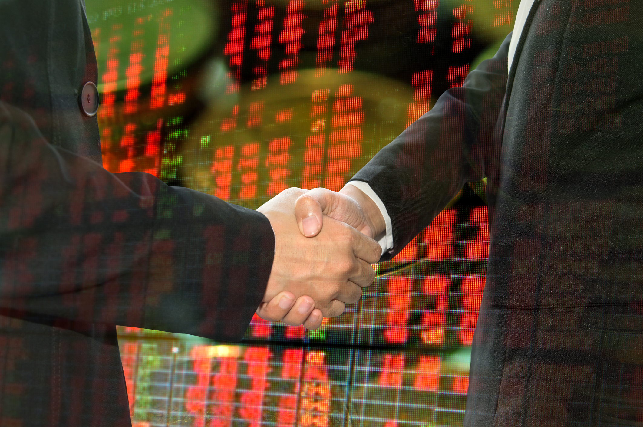 Business shaking hand on finacial graph background. Business shaking hand on finacial graph background.